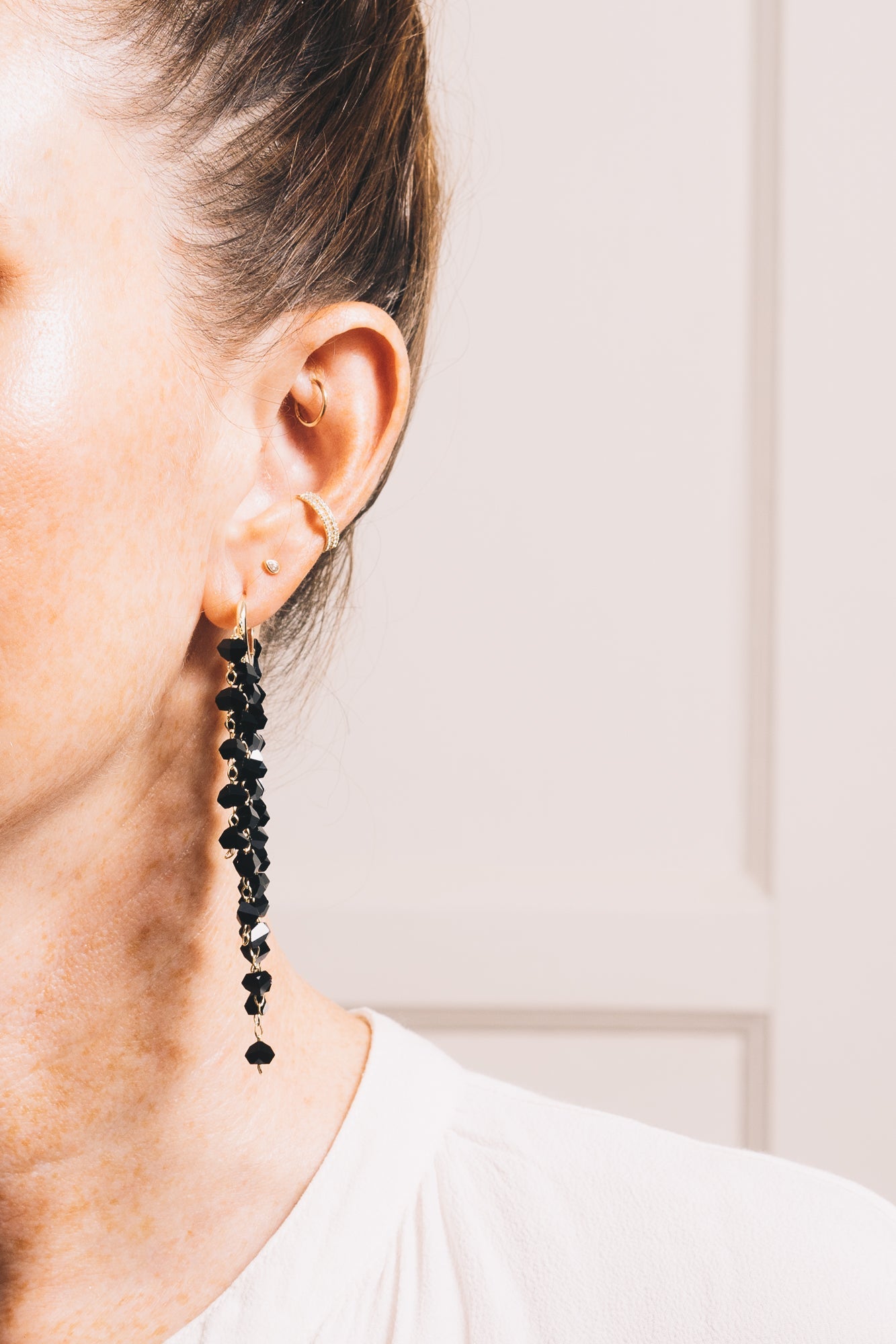 black crystal chandelier earrings on model front view