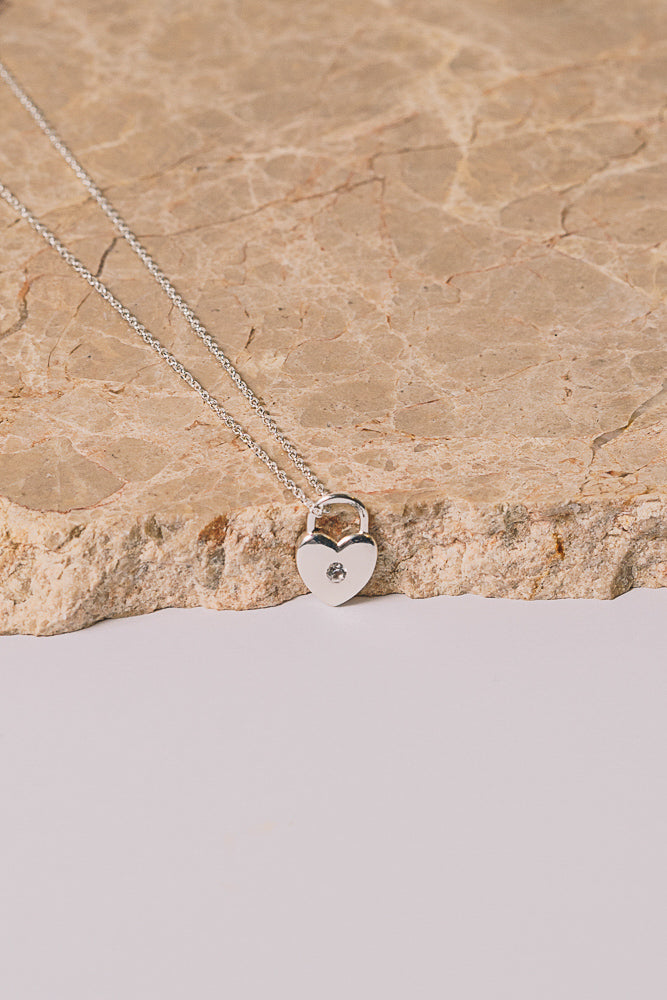 silver heart lock necklace with white sapphire