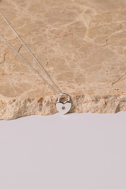 silver heart lock necklace with white sapphire