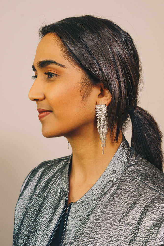 silver statement earrings on model