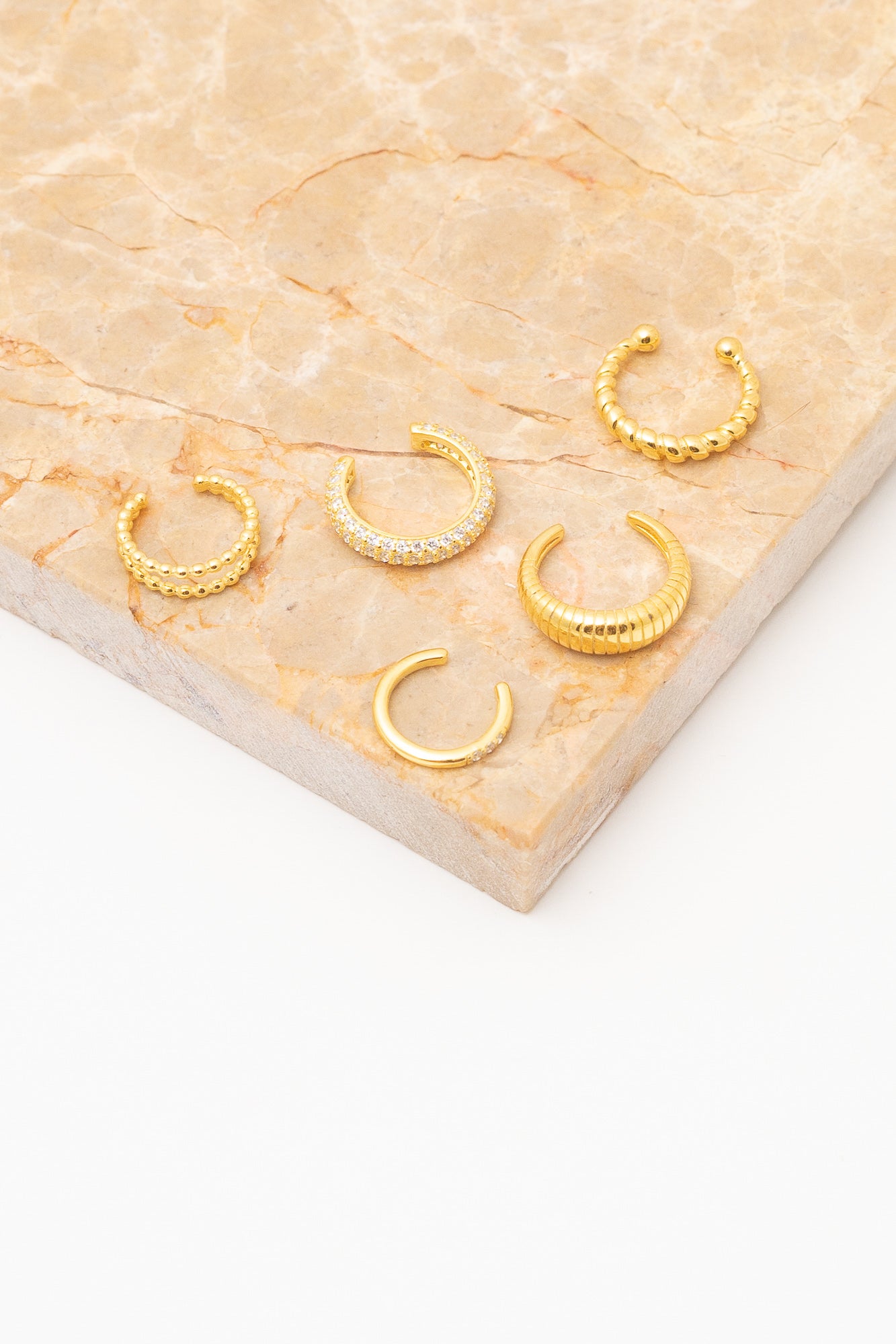 gold ear cuff earrings above view