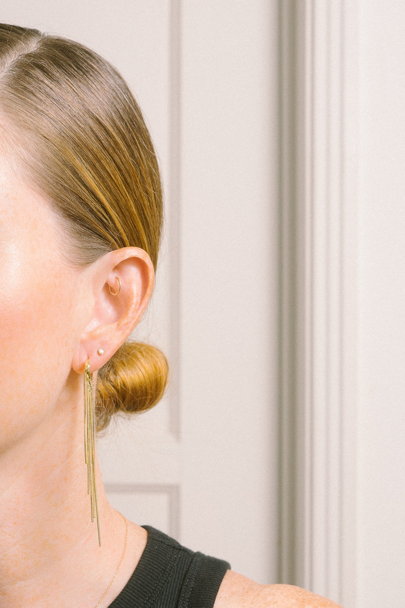 gold chain long earrings on model