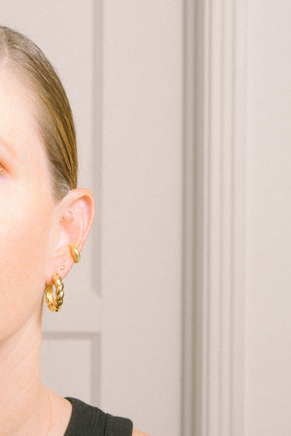 gold ear cuff earring with gold hoops on model