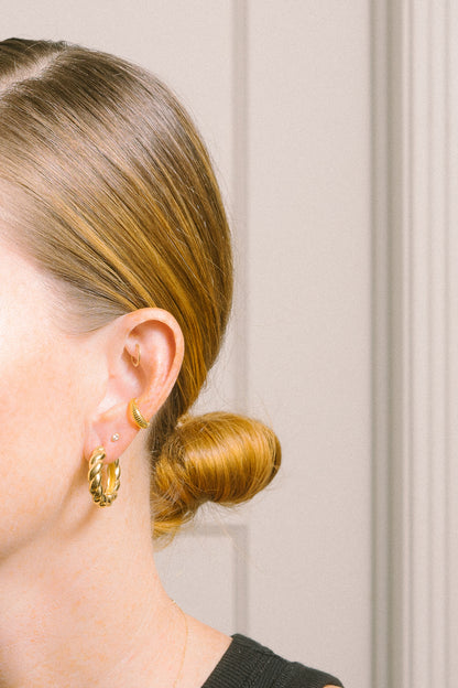 gold ear cuff earring on model side view