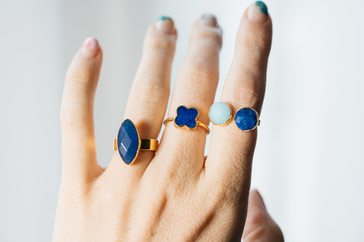 blue lapis stacking rings on hand