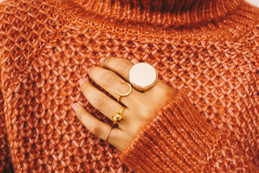 gold stacking rings gold signet ring on hand