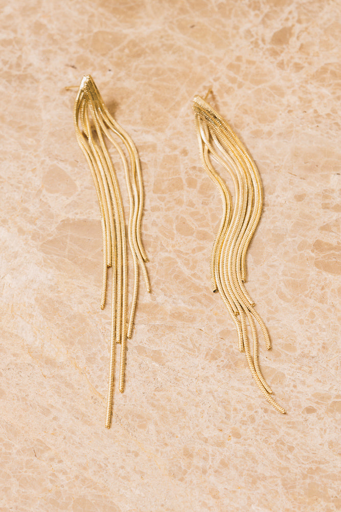 gold chain fringe earrings above view