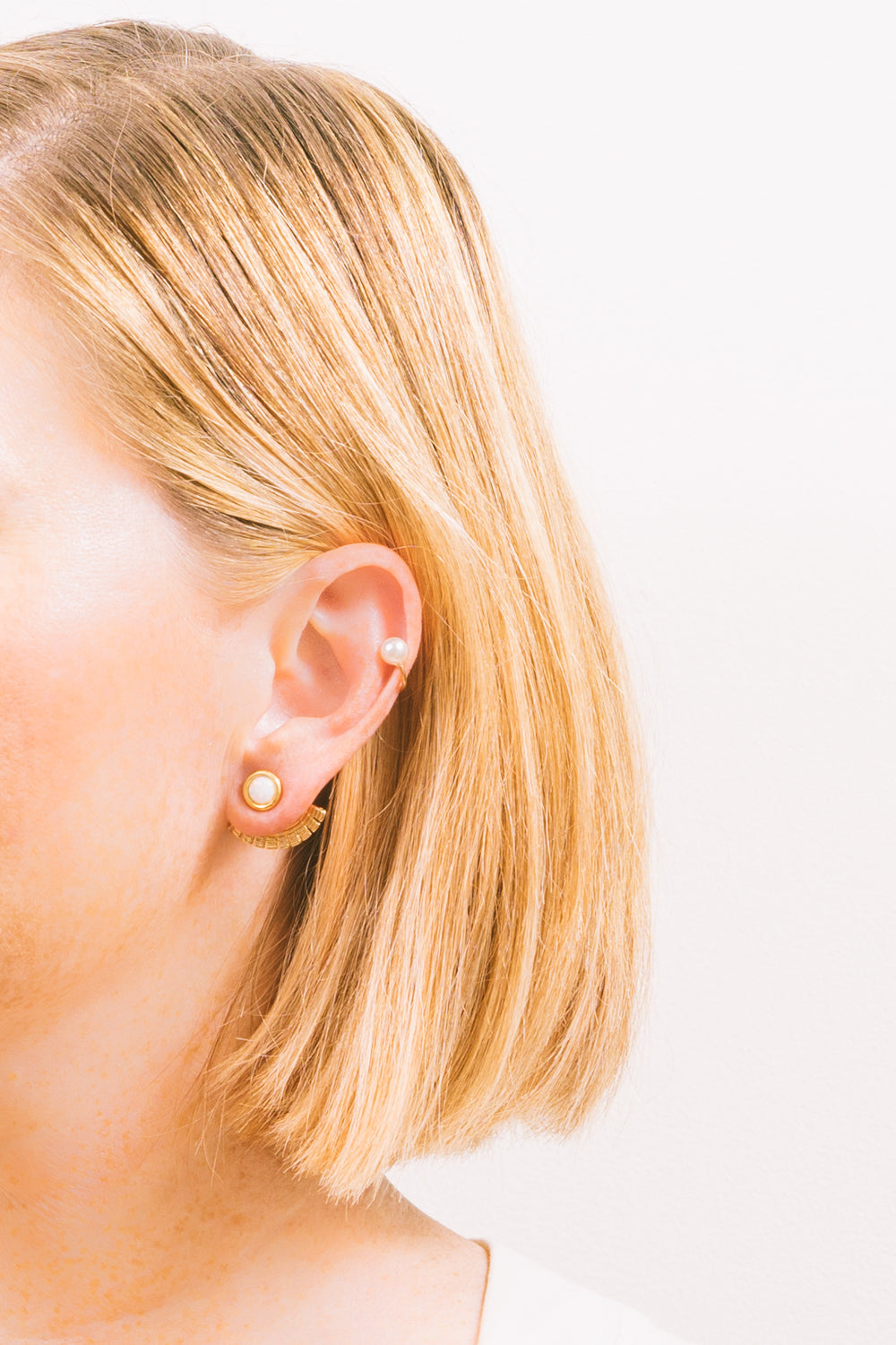 pearl gold ear cuff earrings on model