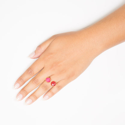 pink and red circle stone open ring on hand