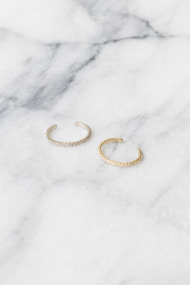 yellow gold and white gold diamond ear cuffs side by side