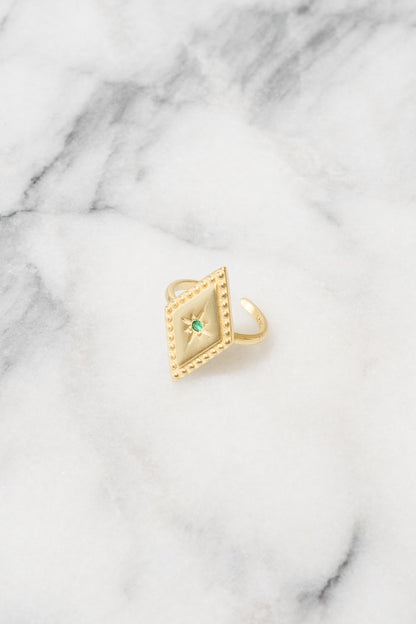 gold diamond shaped stacking ring with green cubic zirconia center