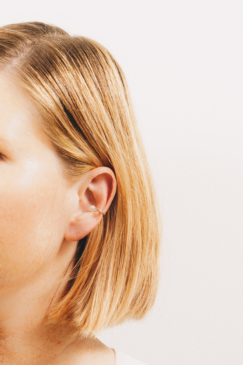 gold ear cuff earrings on model