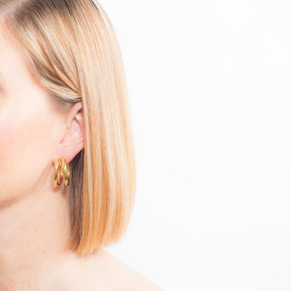 gold split hoop earrings on model with blonde lob shoulder length hair